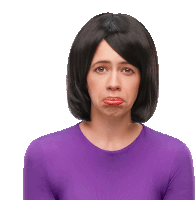 a woman wearing a wig and a purple shirt is making a sad face