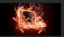 a laptop is surrounded by flames and smoke on a dark background