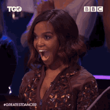 a woman with a surprised look on her face is on a tv show called the greatest dancer