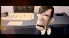 a cartoon man with glasses is sitting at a desk