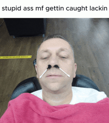 a man with cotton swabs in his nose and the words stupid ass mf gettin caught lakin on the bottom