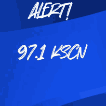 a blue background with the words alert 97.1 ksbn written on it