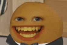 a close up of an orange wearing a suit and bow tie with a big smile on its face .