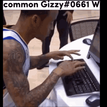 a man is typing on a keyboard with the hashtag common gizzy