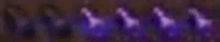 a blurry picture of purple lights on a black background