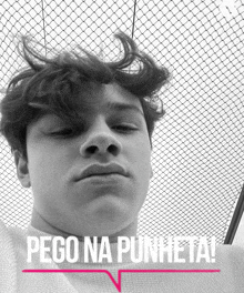 a black and white photo of a young man with the words pego na punheta on the bottom