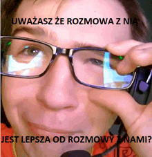 a close up of a person wearing glasses with a foreign language caption