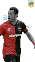 a soccer player wearing a red and black jersey with marquez on it