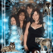 a group of women are posing for a picture with a wolf and a candle in the background .