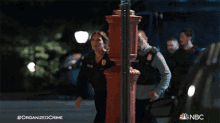 a nbc advertisement for organized crime shows a woman in a police uniform