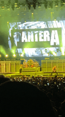 a large screen displays the word pantera on it