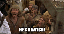 a group of people are laughing and one of them says he 's a witch .