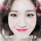 a close up of a woman 's face with the words somi de danita written below her