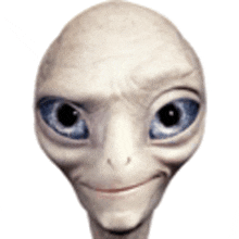 a close up of an alien 's face with blue eyes and a smiling face .