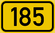 a yellow sign that says 185 in black letters