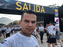 a man taking a selfie in front of a salida sign