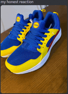 a pair of blue and yellow sneakers with a lidl logo on the side