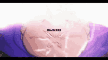 a close up of majin boo 's face in a purple shirt