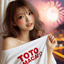 a woman wearing a toto macau t-shirt