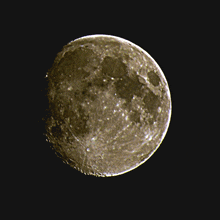 a close up of a full moon on a dark night sky