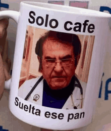 a mug with a picture of a doctor on it that says solo cafe