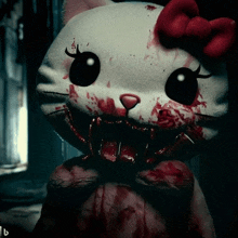 a stuffed hello kitty with blood coming out of her mouth