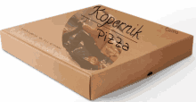 a cardboard box that says kopernik pizza on the top