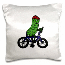 a pickle wearing a red hat is riding a bicycle .