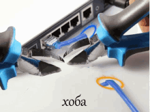 a pair of pliers cutting a cable with the word hoba written on the bottom