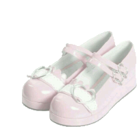 a pair of pink shoes with a white bow on the side