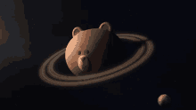 a brown teddy bear with a ring around its head in space