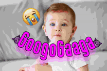 a baby is sitting in front of a sign that says ' googogaga '