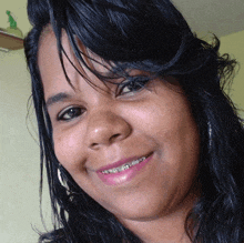 a woman with braces on her teeth smiles for a picture