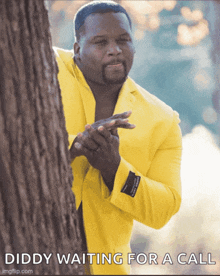 a picture of a man in a yellow suit waiting for a call