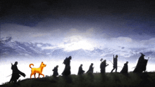 a silhouette of a group of people with a dog in the foreground