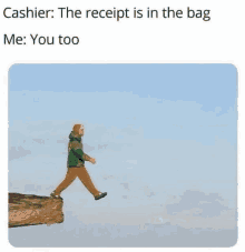 a person is walking across a cliff with a receipt in their bag .