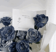 a bouquet of blue roses sits next to a card that says spice studio