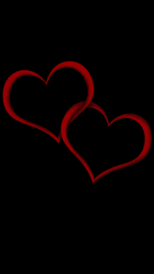 two red hearts on a black background that are connected