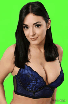 a woman wearing a blue bra with faceapp written on the bottom