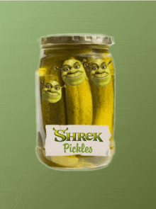 a jar of shrek pickles with shrek 's faces on them