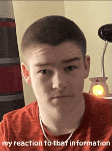 a young man wearing an orange shirt has the words " my reaction to that information " above his face