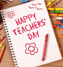 a notebook with the words happy teachers day written in red