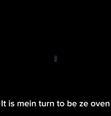 a phone screen shows a cartoon character and says it is mein turn to be ze oven at the bottom