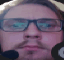 a pixelated image of a man 's face with glasses