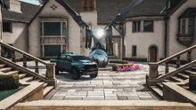 a ram truck is parked in front of a large mansion