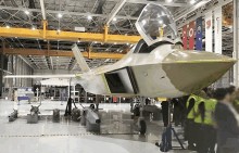 a fighter jet in a hangar with the number 4 on the top of it