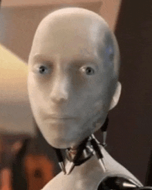 a close up of a robot 's face with a serious look on it .