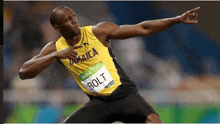 a jamaican athlete wearing a yellow jersey with bolt on it