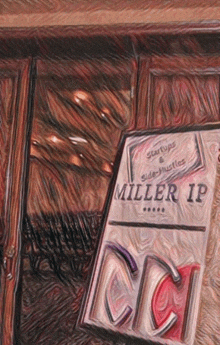 a sign for miller ip sits in front of a wooden door