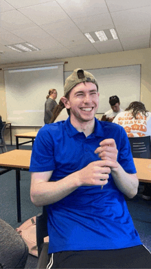 a man wearing a blue shirt that says to have a good time on it